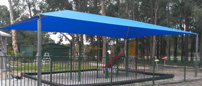 Shade sail over childrens play area image